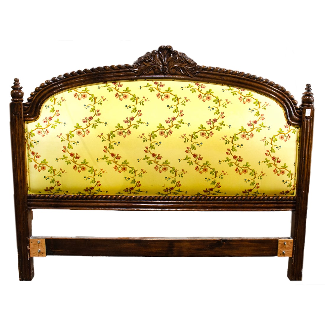 A Provincial style carved and upholstered headboard, Senator Feinstein Estate: A Provincial style carved and upholstered headboard in Pierre Frey fabric in the Sans Papillions Moire pattern, 62.5"h x 78"l x 35."d. Provenance: The Estate of Senator Dianne Feinstein (1933-2023)