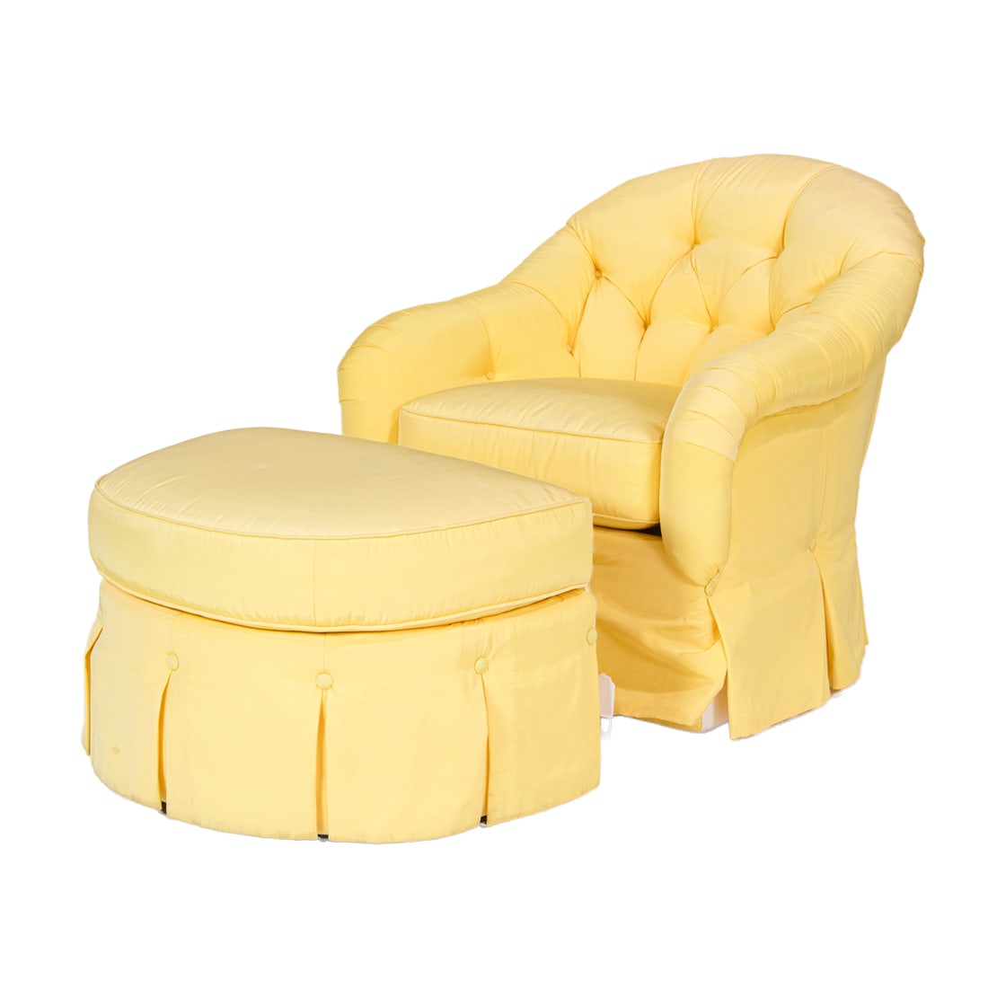 A Kravat upholstered club chair and ottoman, Senator Feinstein Estate: A Kravat upholstered club chair and ottoman, with a tufted back and upholstered in yellow faille, ottoman 19"h x 30"w x 22"d, chair 37"h x 33"w x 27"d Provenance: The Estate of Senator Dianne Feinstei
