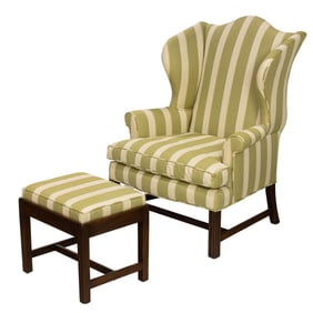 A Georgian style wingback armchair and stool, Senator Feinstein Estate