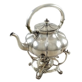 A Mexican Carmen Beckmann sterling silver teapot on stand