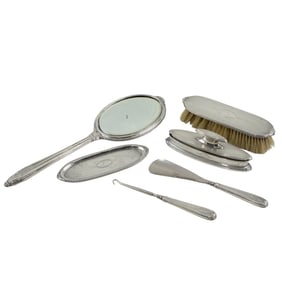A six piece sterling dresser set, each piece monogrammed for Harriet Hume (Krusi)