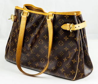 A vintage Louis Vuitton monogram horizontal tote and a Louis Vuitton Elise monogram wallet