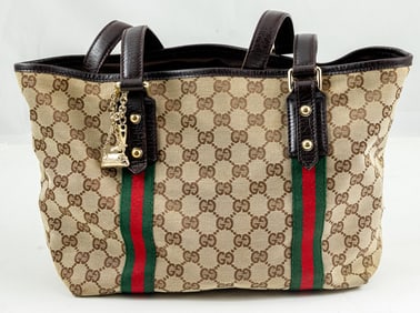 A vintage Gucci GG canvas Jolicoeur tote bag with charms and a Gucci GG canvas Horsebit wallet