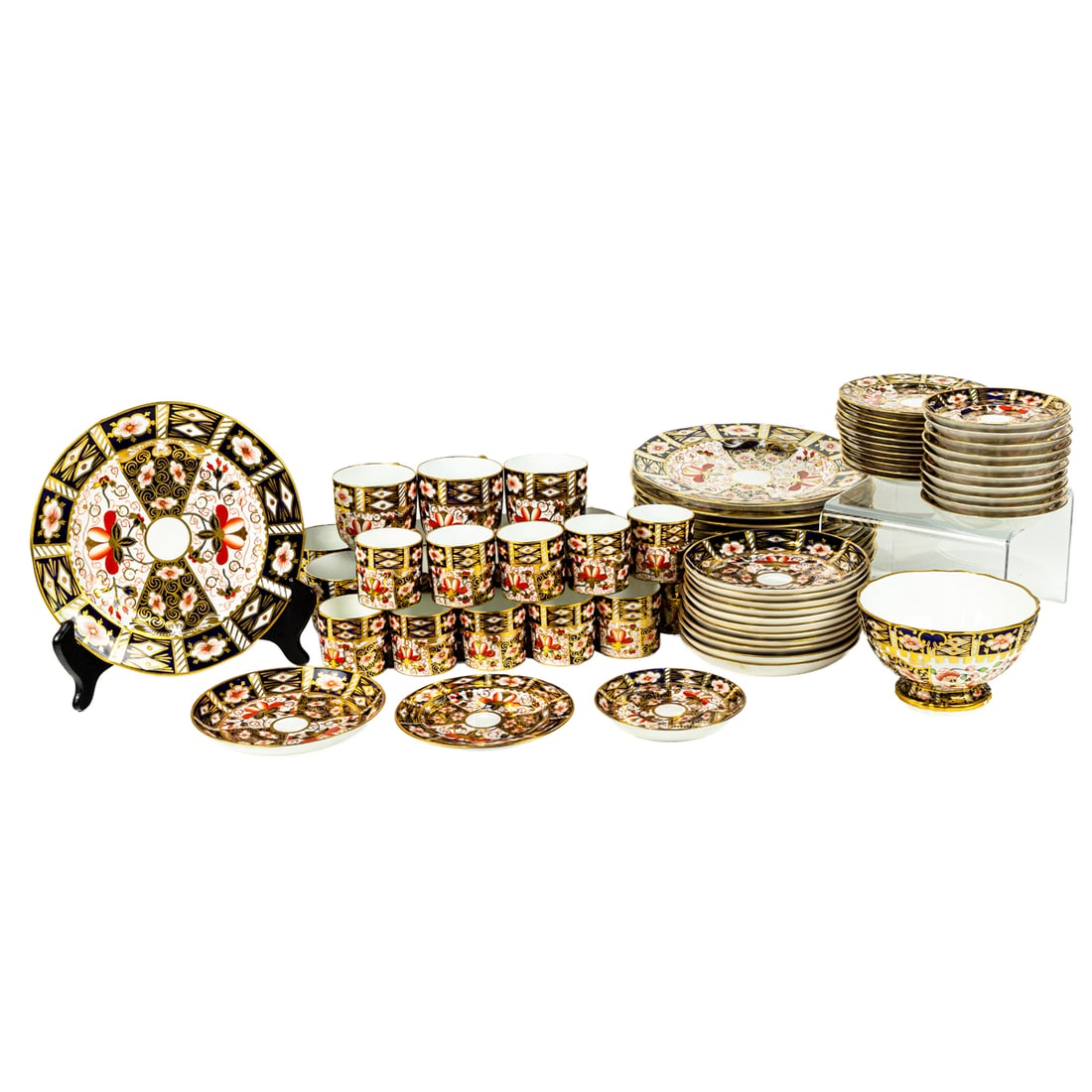 A Royal Crown Derby luncheon service in the Old Imari (2451) pattern: A Royal Crown Derby luncheon service in the Old Imari (2451) pattern, early 20th century (date ciphers for 1910 and 1911), comprising (12) plates, 8"dia; (12) bread & butter plates, 5"dia; (11) cups a