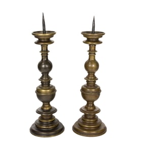 A large pair of Baroque style bronze candle prickets