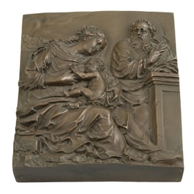 A Continental patinated bronze relief panel depicting the Holy Family