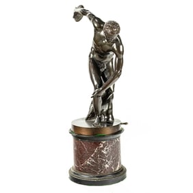 An Italian Grand Tour patinated bronze figure of Discobolus