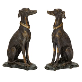 A pair of Italian polychrome carved figures of seated greyhounds
