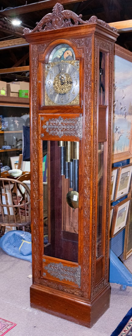 A Tiffany and Co. New York nine tube clock circa 1900: A Tiffany and Co. New York nine tube clock circa 1900, executed in the Gothic Revival taste, with a carved case having large reticulated metal hinges, and a relief carved case, the Walter Durfee movem
