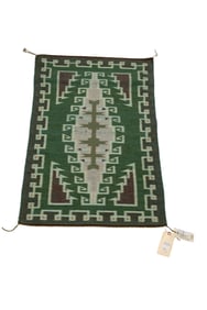 A Navajo Raised Outline rug by Kee Begay