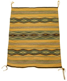 A group of three Navajo rugs