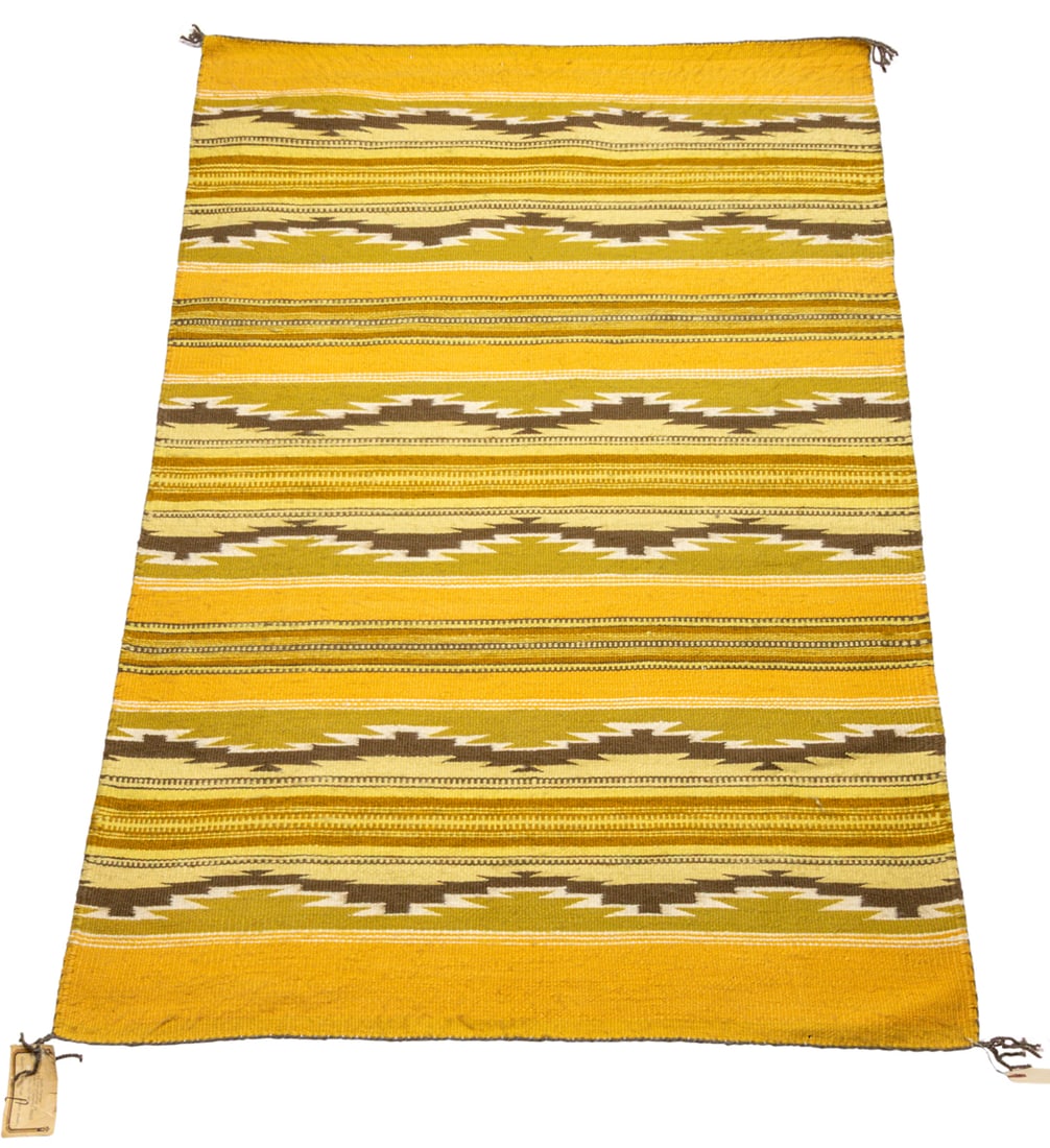 A Navajo Wide Ruins rug woven by Elsie Bowman: A Navajo Wide Ruins rug woven by Elsie Bowman, retains Keith Palmer retail tag, 36" x 53"