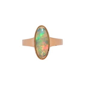An opal and 18k gold ring