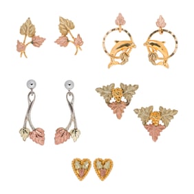 Five pairs of gold and metal earrings