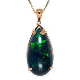 A black opal and 18k gold pendant necklace