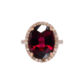 A garnet, diamond, 14k and 18k gold ring