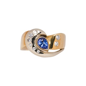 A sapphire, diamond, and 14k gold ring