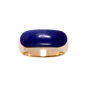A lapis lazuli and 14k gold saddle ring
