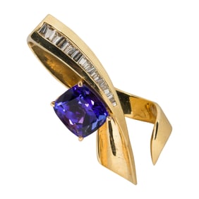 A tanzanite, diamond and 14k gold slide pendant
