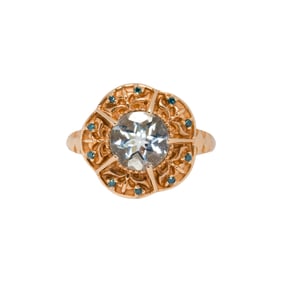 An aquamarine, blue gemstone, and 14k gold ring