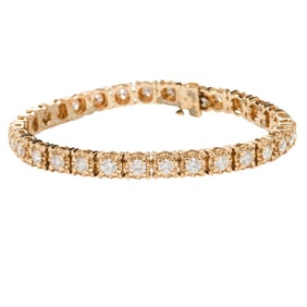A diamond and 14k gold tennis bracelet