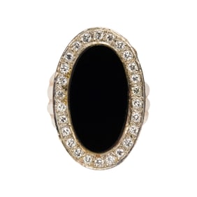 A black onyx, diamond and 14k gold ring