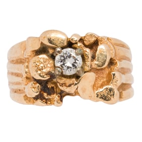 A diamond and 14k gold ring