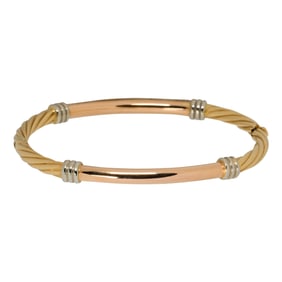 An 18k Milor tri-color gold bangle bracelet