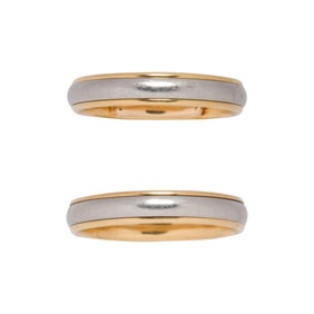A pair of Tiffany & Co. platinum and 18k gold wedding bands