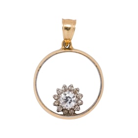 A diamond and 14k bi-color gold pendant