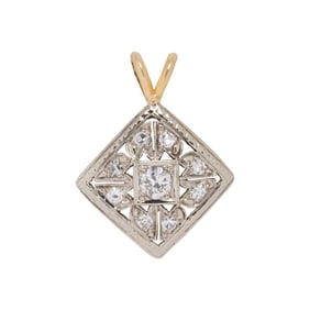 A diamond and 14k bi-color gold pendant