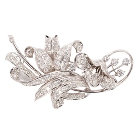 A diamond and platinum brooch