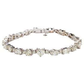 A diamond and 18k white gold tennis bracelet