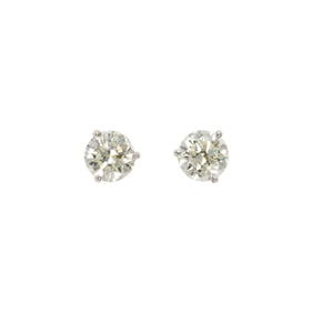 A pair of diamond and 18k white gold solitaire earrings