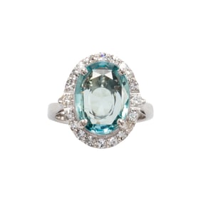 A blue-green sapphire, diamond, and 18k white gold ring