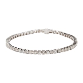 A diamond and 14k white gold tennis bracelet