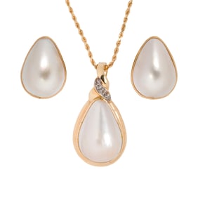 A mabe cultured pearl, diamond, and 14k gold earrings and pendant necklace set
