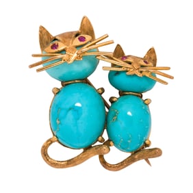 A turquoise and 14k gold brooch