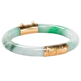 A jade and 14k gold bangle bracelet