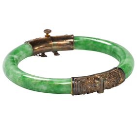 A jade and 10k gold bangle