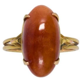 A red jade and 14k gold ring