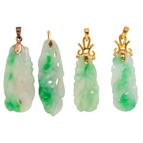 Four jade and 14k gold pendants