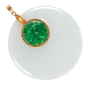 A jade and 14k gold pendant