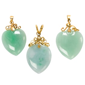 Three jade and 14k gold pendants