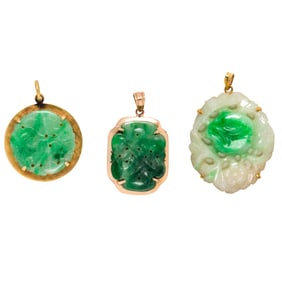 Three jade, 14k, and 10k gold pendants