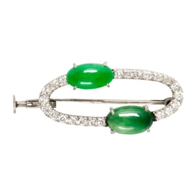 A jade, diamond, and platinum brooch