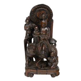 A Chinese wood carving of a Daoist deity