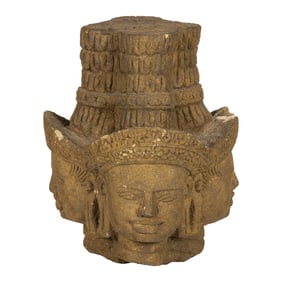 A Khmer sandstone head of Brahma