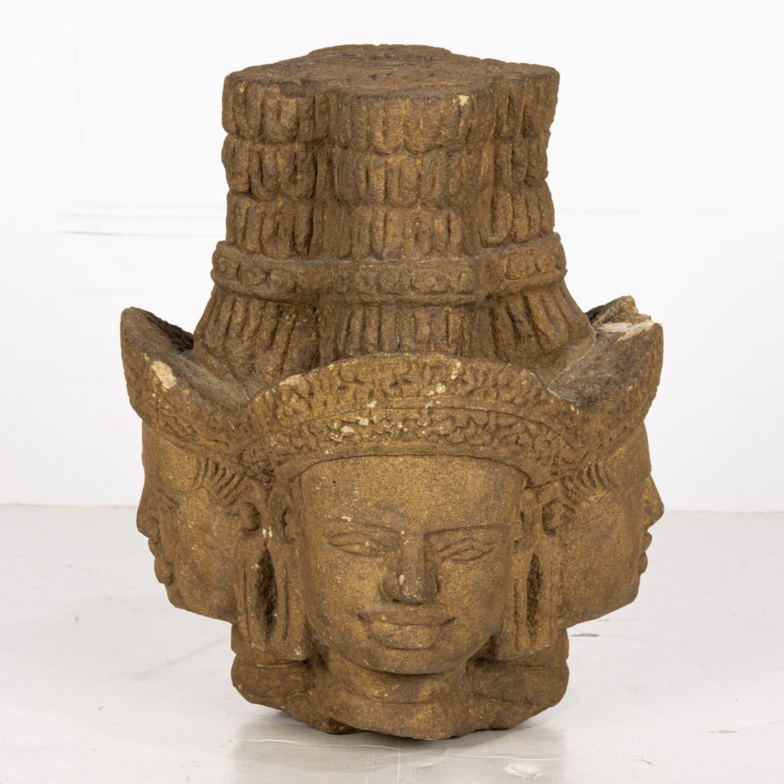 A Khmer sandstone head of Brahma (1 of 4)