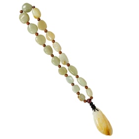 A Chinese russet jade bead necklace and pendant